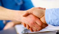 Two people shaking hands as a symbol of cooperation and trust in business